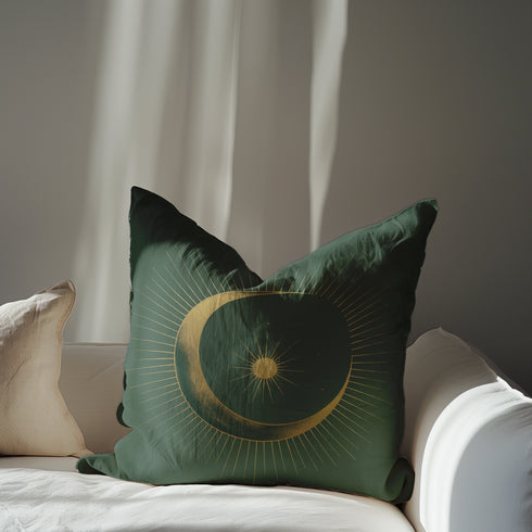 Emerald green throw pillow cover featuring a golden crescent moon and sun design with radiating lines, perfect for celestial or bohemian decor themes.